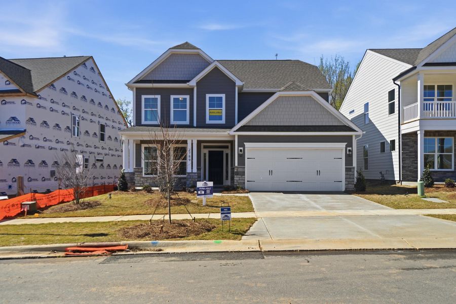 Front exterior of a new home in Ashton Park, Monroe, NC, highlighting curb appeal (Image 22). Front exterior of a new home in Ashton Park, Monroe, NC, highlighting curb appeal (Image 22).