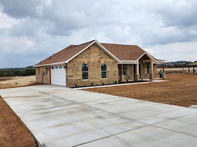 Front exterior of a new home in , Nemo, TX, highlighting curb appeal (Image 1). Front exterior of a new home in , Nemo, TX, highlighting curb appeal (Image 1).