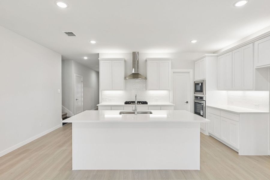 Kitchen in the Masters home plan by Trophy Signature Homes – REPRESENTATIVE PHOTO