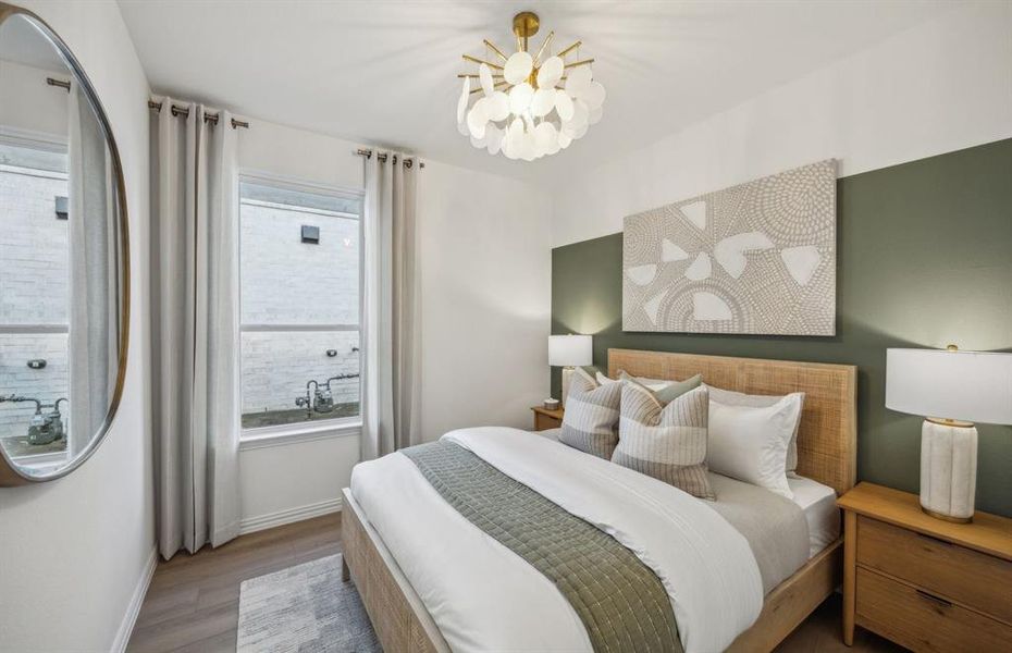 Comfortable secondary bedroom with generous closet space *Model representation