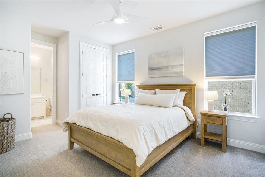Comfort Elevated - Spacious secondary bedroom with dual windows and an en-suite bath nearby. Neutral finishes and plush carpet add warmth and quiet. Comfort Elevated - Spacious secondary bedroom with dual windows and an en-suite bath nearby. Neutral finishes and plush carpet add warmth and quiet.
