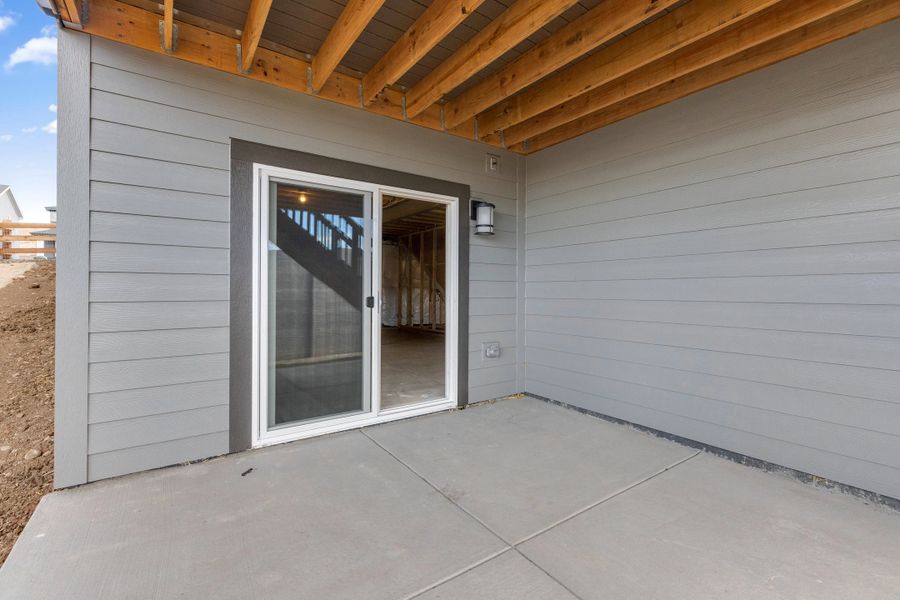 Exterior details and patio area of a home in The Manors Collection at Golden Overlook, Golden (Image 3).