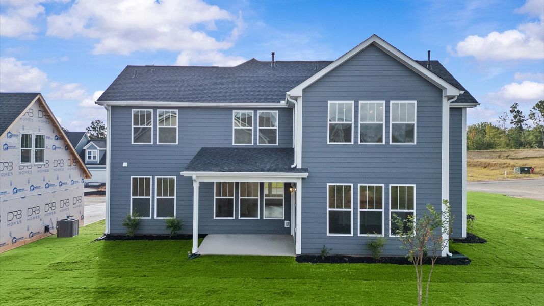 Warm and inviting outdoor living space with a covered rear porch and tasteful finishes