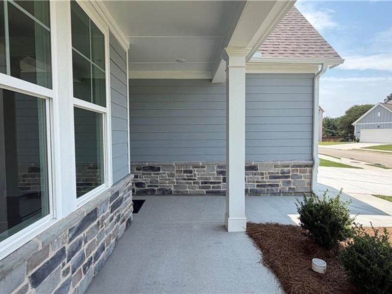 Exterior details and patio area of a home in Wehunt Meadows, Hoschton (Image 3).