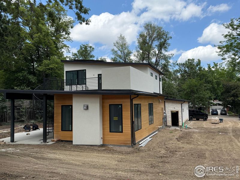 Front exterior of a new home in , Boulder, CO, highlighting curb appeal (Image 12).