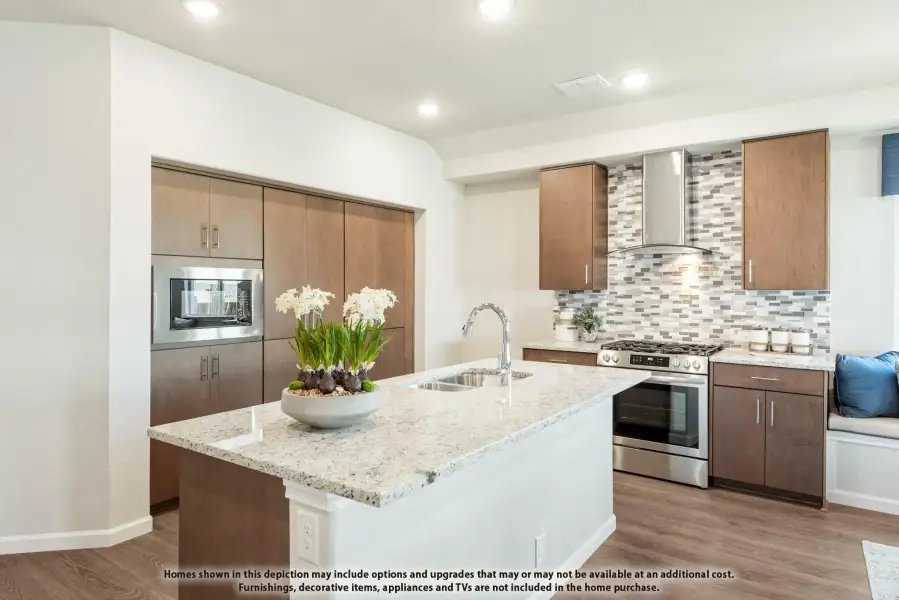 Kitchen with granite island, dark wood cabinets, tile backsplash, and stainless steel appliances