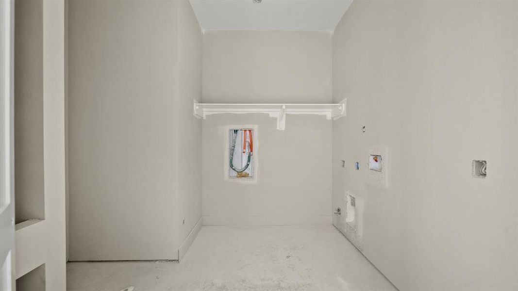 Laundry room with a dog wash area.