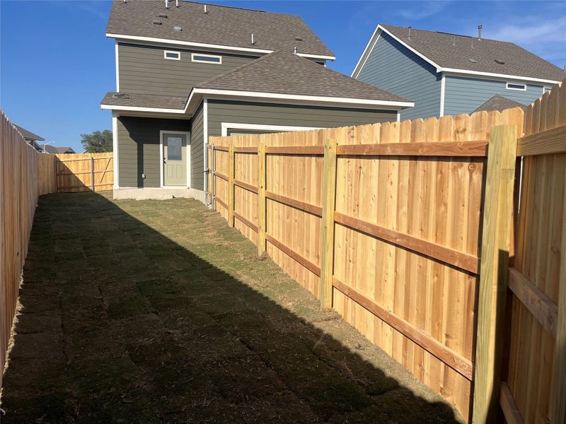 Exterior details and patio area of a home in The Cottages at Lariat, Liberty Hill (Image 17).