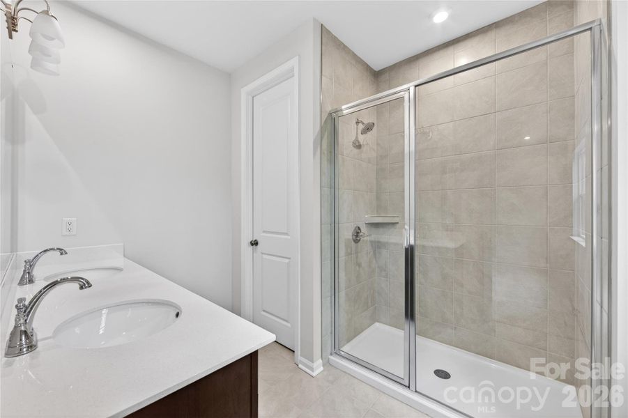 Dual vanity primary bathroom with walk-in shower Dual vanity primary bathroom with walk-in shower