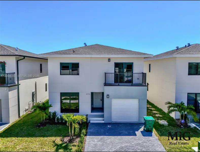 Front exterior of a new home in , Florida City, FL, highlighting curb appeal (Image 1). Front exterior of a new home in , Florida City, FL, highlighting curb appeal (Image 1).