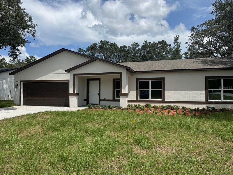 Front exterior of a new home in , Citrus Springs, FL, highlighting curb appeal (Image 2).