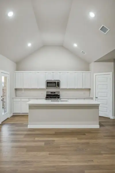 Kitchen in the Wimbledon home plan by Trophy Signature Homes – REPRESENTATIVE PHOTO Kitchen in the Wimbledon home plan by Trophy Signature Homes – REPRESENTATIVE PHOTO