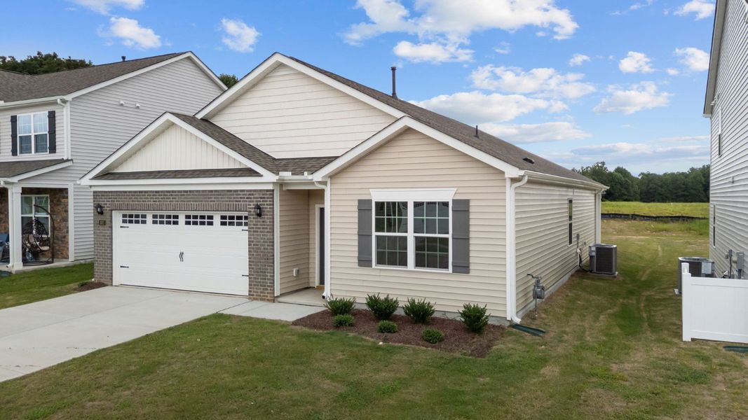 Front exterior of a new home in Saddlebrook, Rocky Mount, NC, highlighting curb appeal (Image 15).