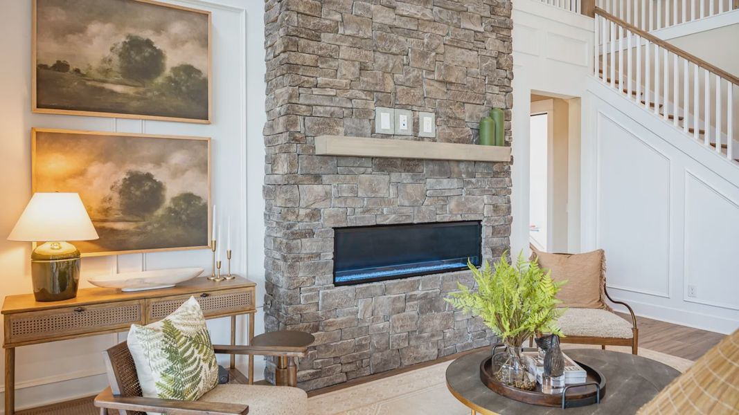 Gathering room with fireplace and access to rear porch Gathering room with fireplace and access to rear porch