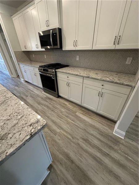 Furnished interior view inside a new home in Mirror Lake, Villa Rica (Image 4).