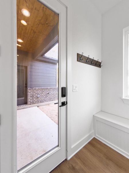 Doorway to outside covered parking and detached garage. Doorway to outside covered parking and detached garage.