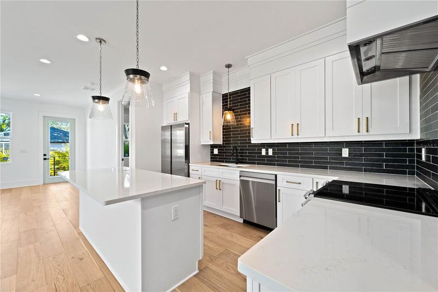 Modern Black & White Kitchen with Tile Backsplash