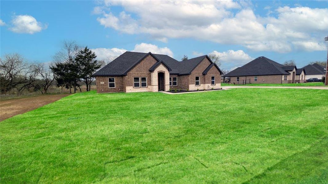 Front exterior of a new home in , Greenville, TX, highlighting curb appeal (Image 23).