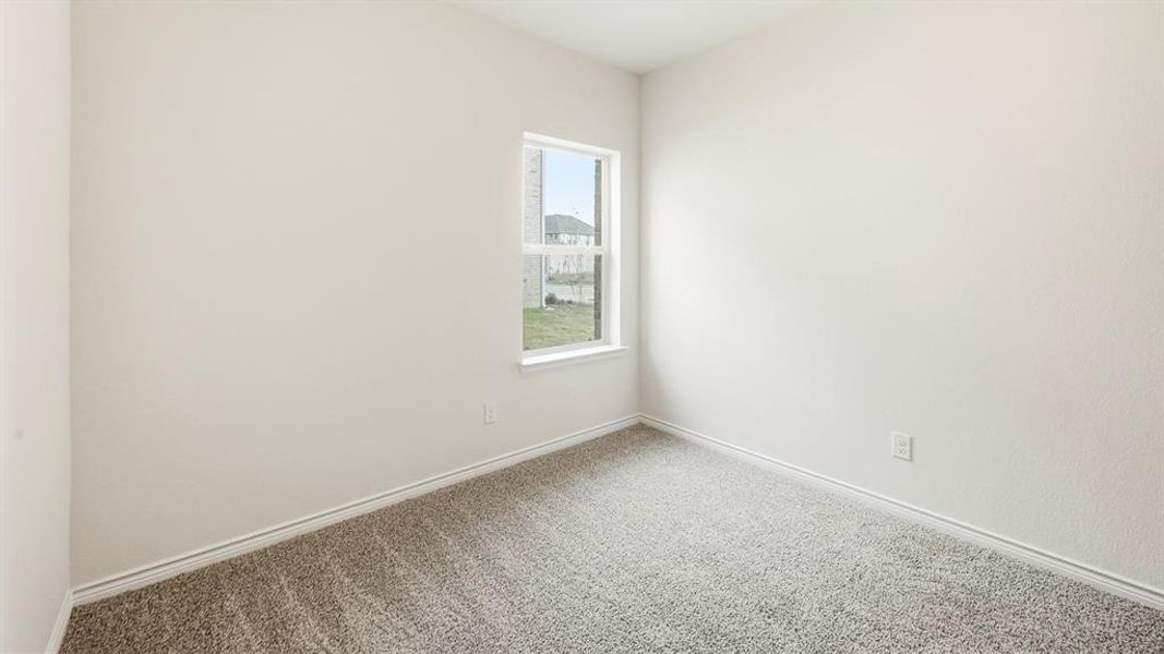 Unfurnished room featuring carpet and baseboards