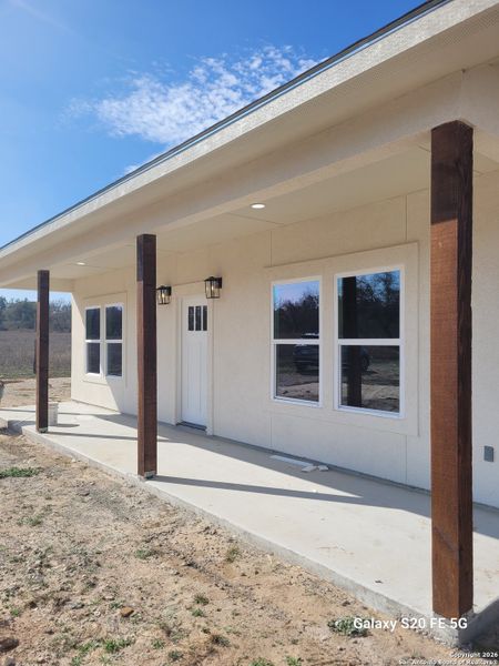 Exterior details and patio area of a home in , Floresville (Image 12).