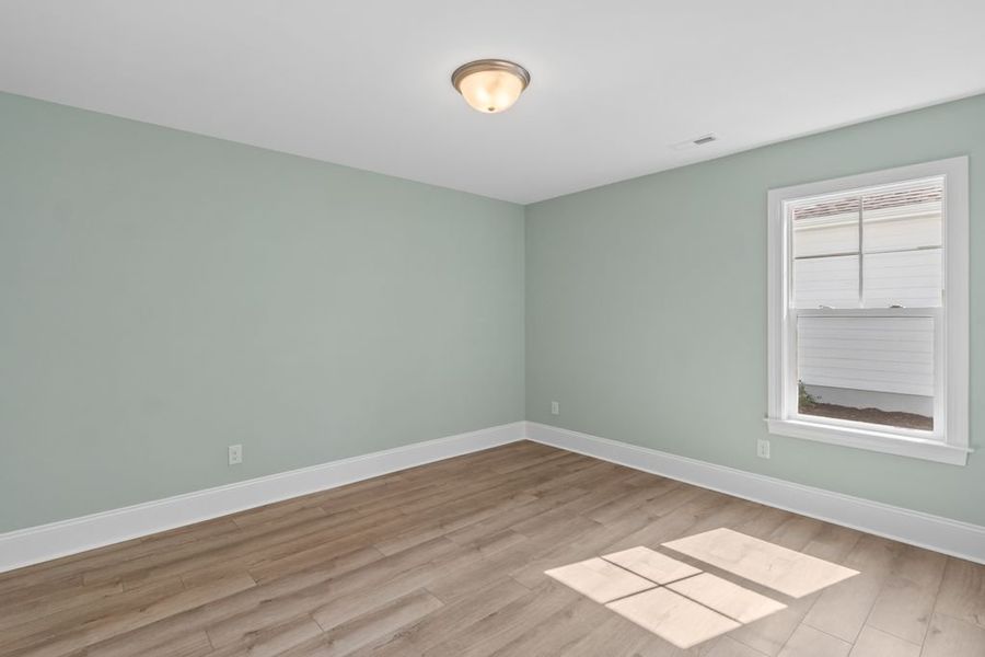 Representative unfurnished interior of a home built from the Salt Marsh by Bill Clark Homes in Osprey Landing, Southport (Image 23).