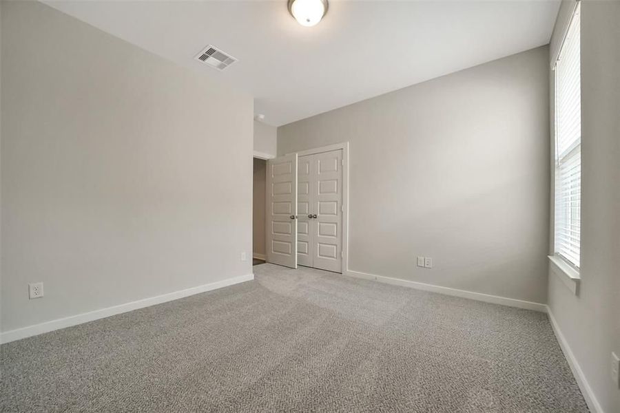 Spacious, unfurnished interior of a new home in Sunterra, Katy (Image 51).