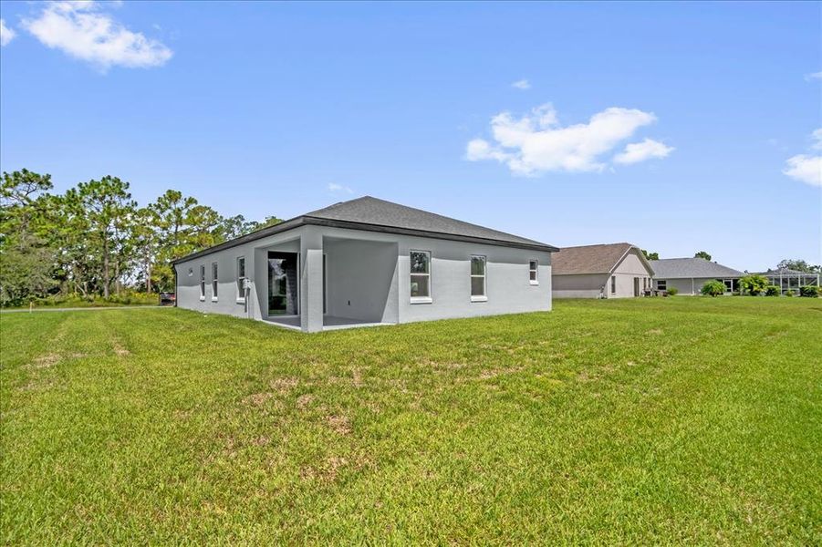 Exterior details and patio area of a home in , Brooksville (Image 3).
