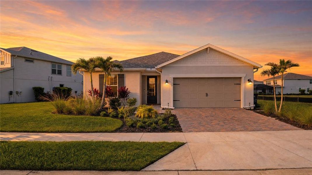 Front exterior of a new home in , Punta Gorda, FL, highlighting curb appeal (Image 2).