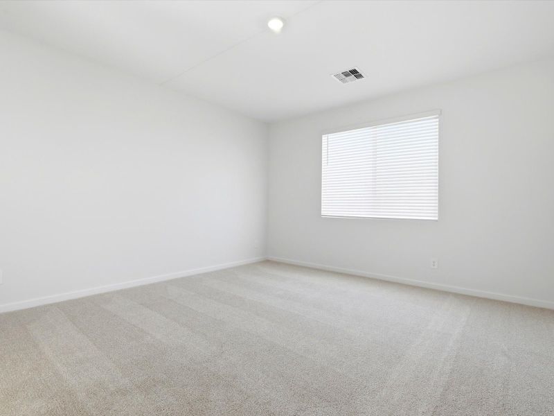 Spacious, unfurnished interior of a new home in White Tank Foothills Reserve Series, Waddell (Image 17).