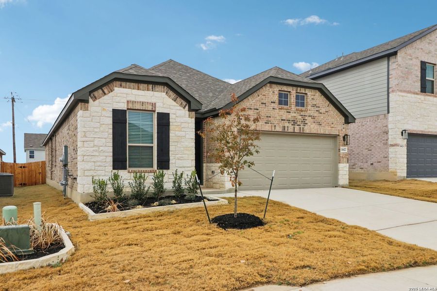 Front exterior of a new home in Kallison Ranch, San Antonio, TX, highlighting curb appeal (Image 20).