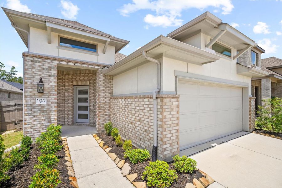 This angle tells the whole story. Light brick, stucco accents, and a modern craftsman glass-panel front door that bridges classic and contemporary before you even step inside. Let's go inside! This angle tells the whole story. Light brick, stucco accents, and a modern craftsman glass-panel front door that bridges classic and contemporary before you even step inside. Let's go inside!