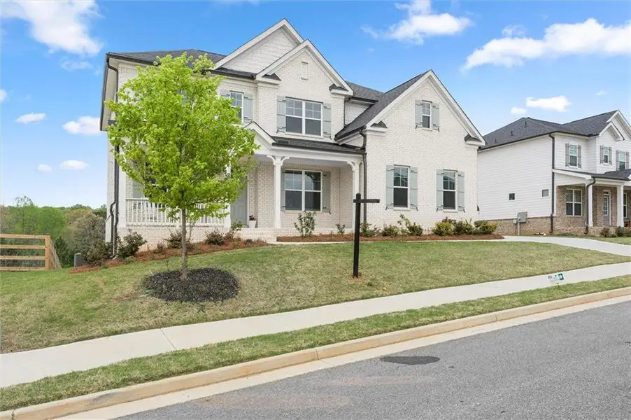 Front exterior of a new home in , Canton, GA, highlighting curb appeal (Image 1). Front exterior of a new home in , Canton, GA, highlighting curb appeal (Image 1).
