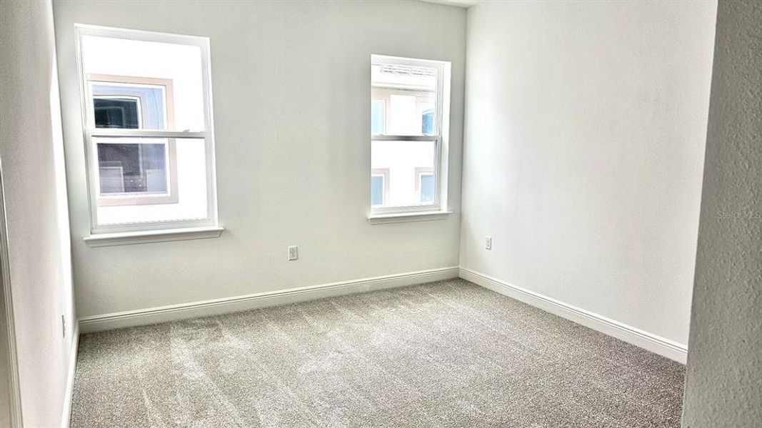 Spacious, unfurnished interior of a new home in Laureate Park, Orlando (Image 21).