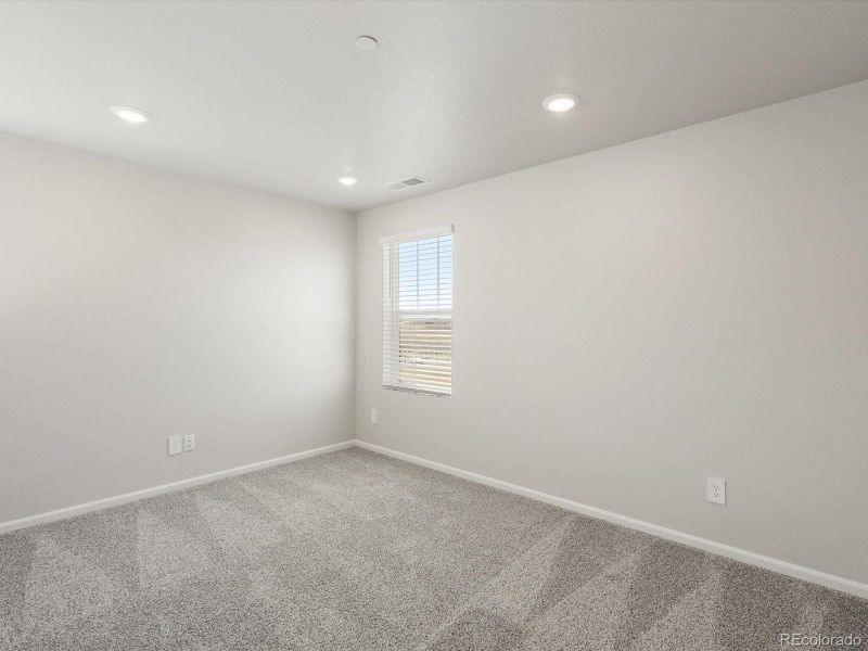 Spacious, unfurnished interior of a new home in Buffalo Highlands: The Flora Collection, Commerce City (Image 25).