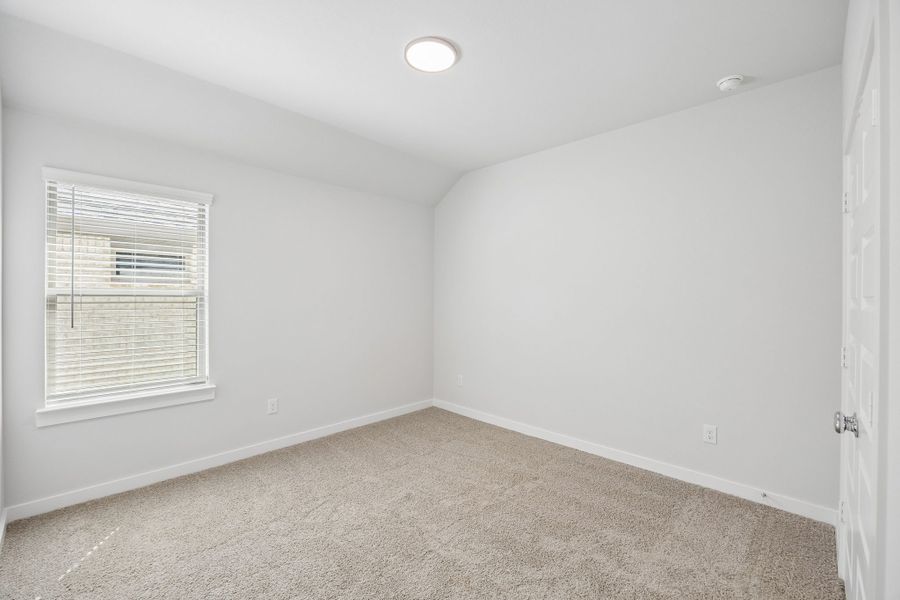 Bedroom in the Oscar home plan by Trophy Signature Homes – REPRESENTATIVE PHOTO
