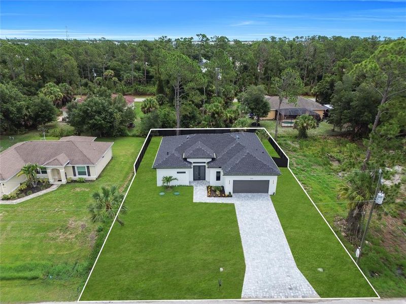 Front exterior of a new home in , North Port, FL, highlighting curb appeal (Image 2). Front exterior of a new home in , North Port, FL, highlighting curb appeal (Image 2).