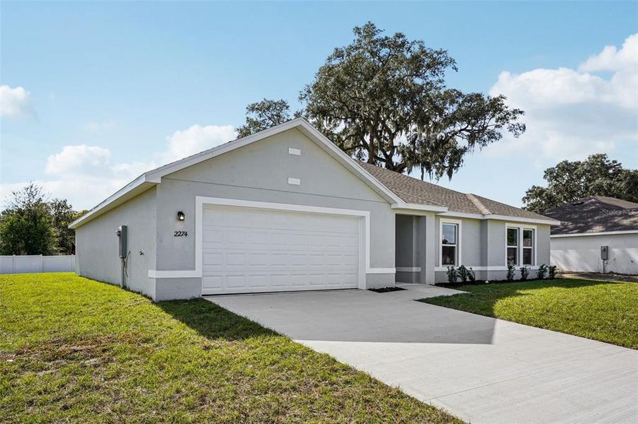 Front exterior of a new home in Sable Run, Ocala, FL, highlighting curb appeal (Image 2). Front exterior of a new home in Sable Run, Ocala, FL, highlighting curb appeal (Image 2).