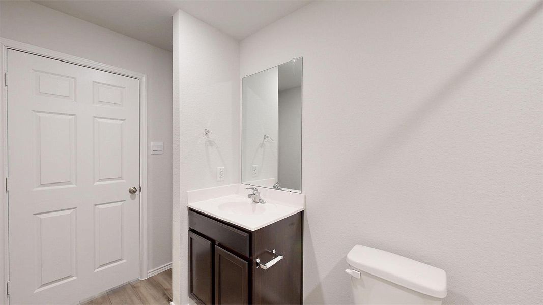Bathroom with vanity and light wood-style flooring