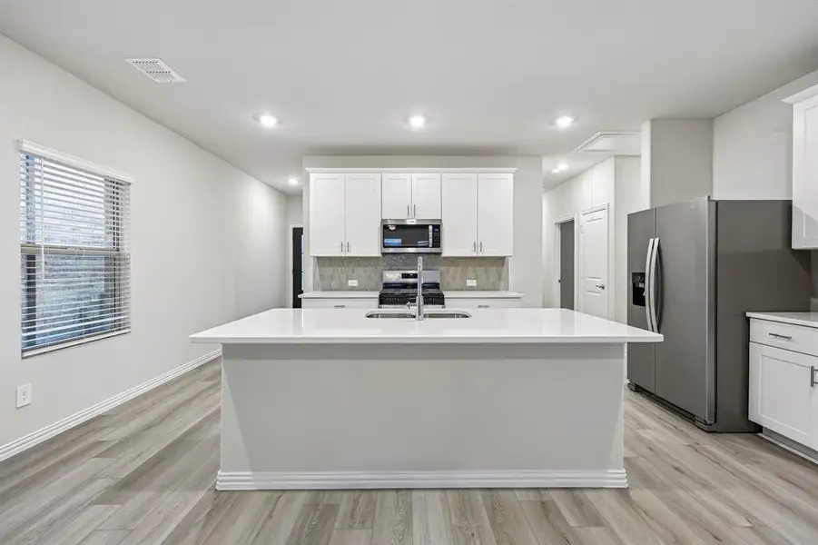 Furnished interior view inside a new home in Parks at Foster Crossing - Spring Series, Anna (Image 8).