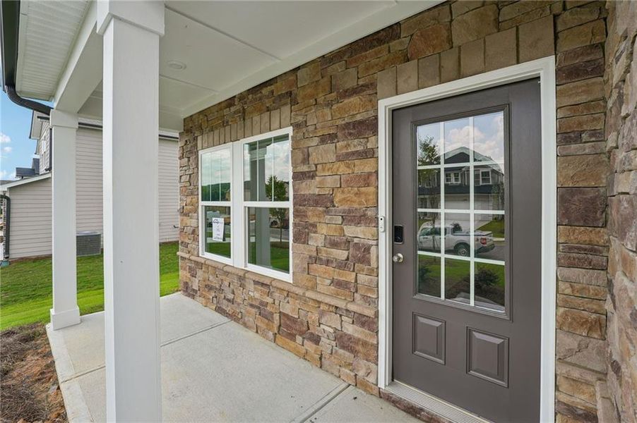 Exterior details and patio area of a home in Northwoods at Mirror Lake, Villa Rica (Image 28).
