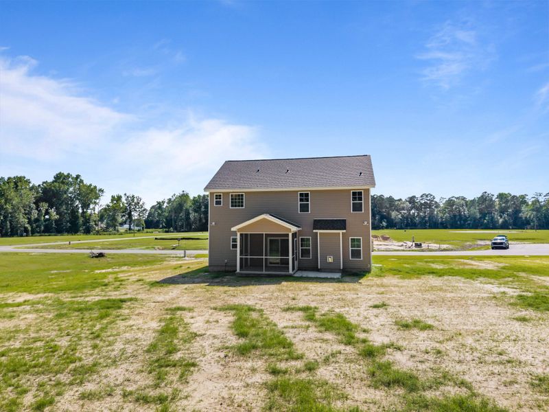 Front exterior of a new home in Laurel Oaks, Greenville, NC, highlighting curb appeal (Image 28). Front exterior of a new home in Laurel Oaks, Greenville, NC, highlighting curb appeal (Image 28).