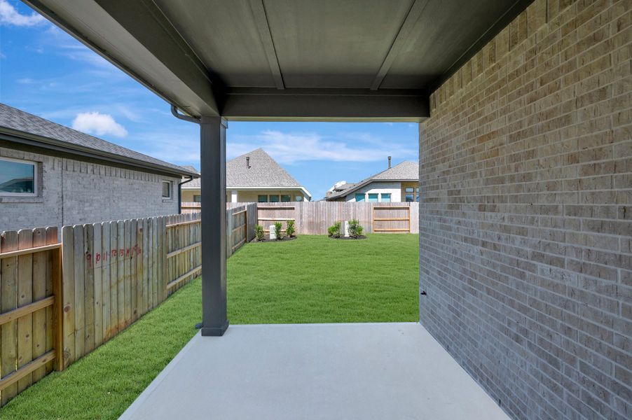 Exterior details and patio area of a home in The Grand Prairie - Retreat Collection, Hockley (Image 32).