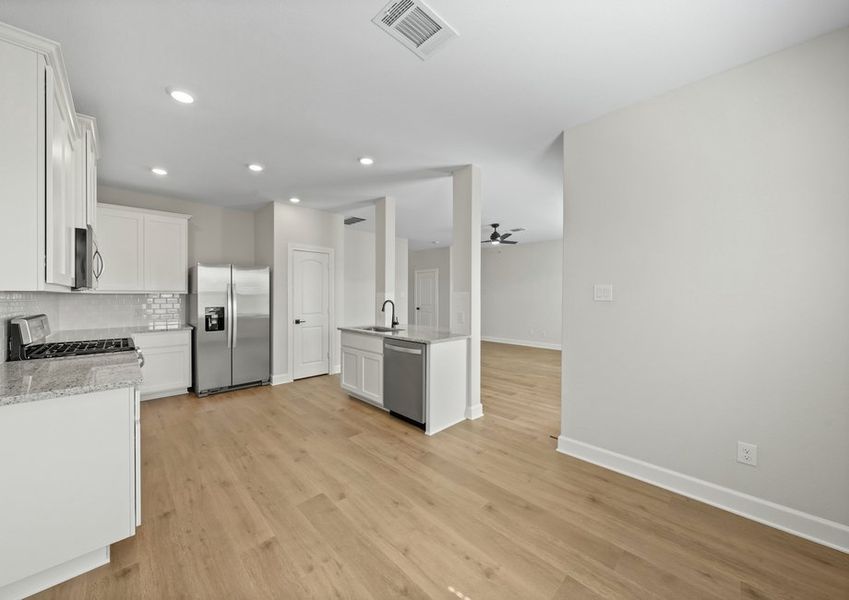 The dining room sits adjacent to the kitchen. The dining room sits adjacent to the kitchen.