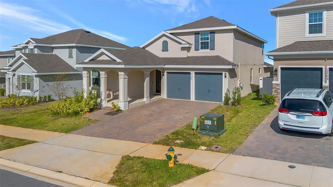Front exterior of a new home in , Minneola, FL, highlighting curb appeal (Image 24). Front exterior of a new home in , Minneola, FL, highlighting curb appeal (Image 24).