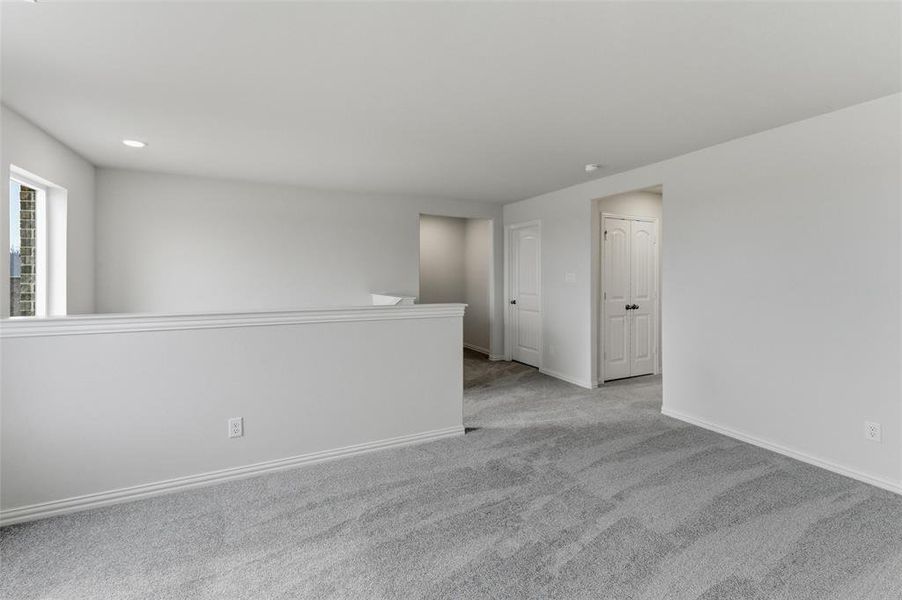Unfurnished room with carpet floors and recessed lighting