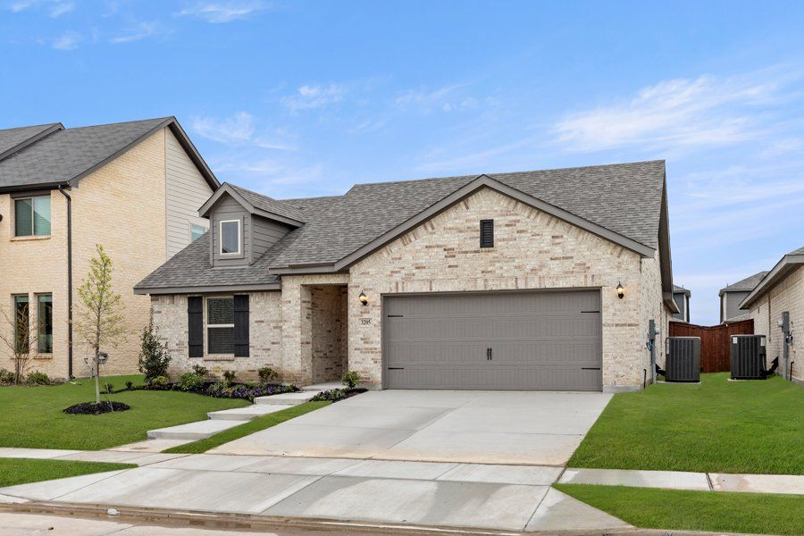 Representative exterior photo of a completed home built from the Cheyenne by Impression Homes in DeBerry Reserve, Royse City, TX (Image 2).