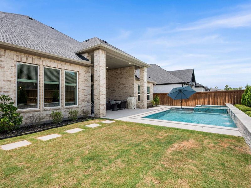 Exterior details and patio area of a home in , Spring (Image 25).