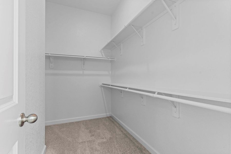 Expansive walk-in closet with abundant hanging space and built-in shelving, offering both style and convenience for effortless organization. LOOK AT THE LISTING ON DOCUMENTS AND YOU CAN SEE THE FLOOR PLAN FOR MORE INFORMATION OF THIS STUNNING NEW CASTLEROCK COMMUNITIES HOME! Expansive walk-in closet with abundant hanging space and built-in shelving, offering both style and convenience for effortless organization. LOOK AT THE LISTING ON DOCUMENTS AND YOU CAN SEE THE FLOOR PLAN FOR MORE INFORMATION OF THIS STUNNING NEW CASTLEROCK COMMUNITIES HOME!