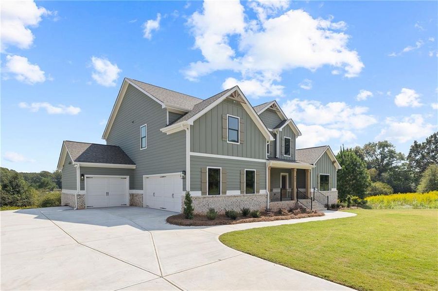 Front exterior of a new home in SteepleChase, Hoschton, GA, highlighting curb appeal (Image 24).
