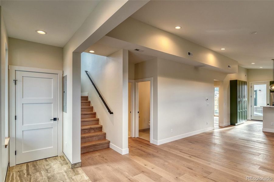 Tiled foyer with engineered hardwood floors throughout the home